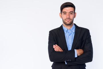 Portrait of young bearded Persian businessman with arms crossed