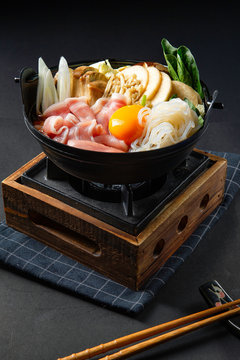Japanese hotpot buta akakara nabe with pork rice set . In lighting studio .