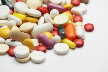 Different colorful tablets at white background