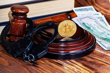 bitcoin, judge's hammer, handcuffs. Concept bitcoin ban, violation of the law.