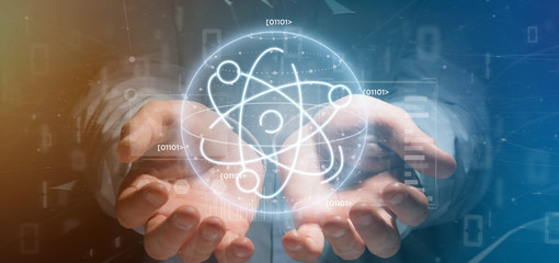 Businessman holding an atom icon surrounded by data
