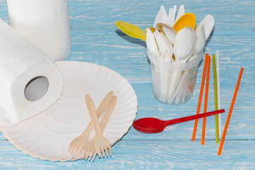 Disposable picnic dishes on a light background. Sale of disposable tableware.