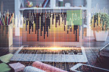 Double exposure of graph and financial info and work space with computer background. Concept of...
