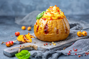 Baked pumpkin stuffed with couscous and vegetables.
