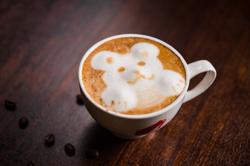 Latte coffee on wood with space