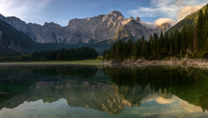 beautiful sunrise over the mountain lake in the Julian Alps