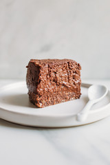 vegetarian chocolate cake. sugar-free, milk-free dessert on marble background with copy space