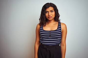 Obraz premium Transsexual transgender woman wearing striped t-shirt over isolated white background depressed and worry for distress, crying angry and afraid. Sad expression.