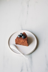 vegetarian chocolate cake. sugar-free, milk-free dessert on marble background with copy space