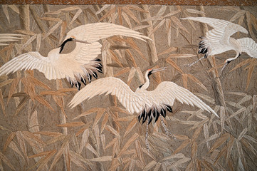 Fototapety  Crane embroidery with silk thread on tapestry.