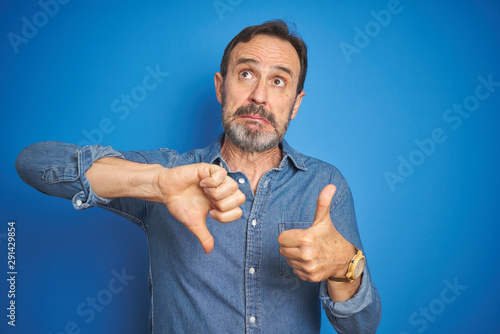Handsome Middle Age Senior Man With Grey Hair Over Isolated Blue