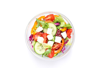 Glass bowl with fresh salad isolated on white background