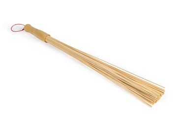 Bamboo massage broom on a white background