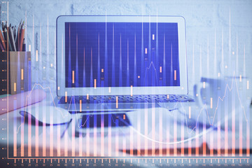 Forex market graph hologram and personal computer on background. Multi exposure. Concept of investment.