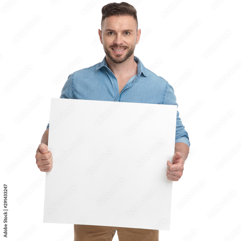 Canvas Prints casual man standing with billboard on hands happy