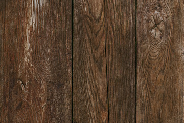 Dark wood timber background. Old wooden planks, texture. Cracked fence. Shabby desk surface. Brown oak boards. Vintage wall, pattern. Weathered hardwood.
