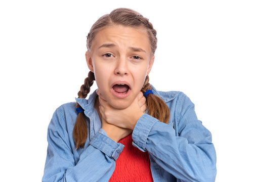Emotional portrait of caucasian teen girl with hands on neck. Crazy child, isolated white background. Beautiful funny teenager choke sheself and clenching hands on neck. Negative emotions.