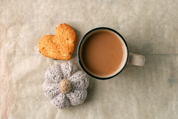 Tasty cocoa, cookies and knitted handcrafted pumpkin on the table, Thanksgiving autumn fall seasonal concept, moody season breakfast, copy space