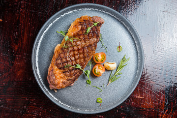 Grilled strip steak with spices