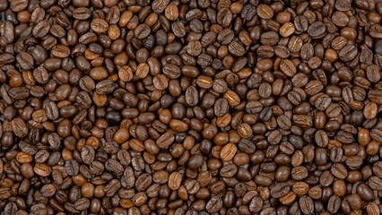 Roasted coffee beans background, Close Up mixture of different kinds of coffee beans.