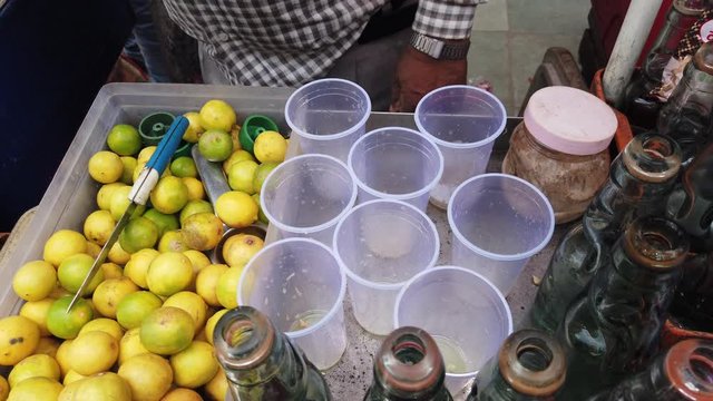 Street vendor in Delhi preparing a glass of Lemon or Nimbu Soda or Banta, a drink which helps acidity to cool down and give your fried food a chill. Popular in north Indian summer. 4k 60fps gimbal 