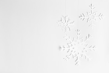 background with hanging paper snowflakes, homemade