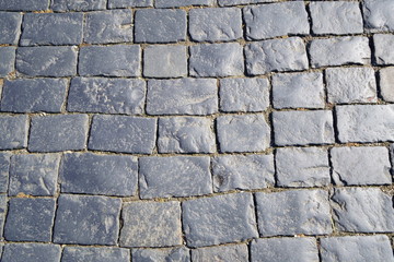 Square granite stones. Stone pavement texture