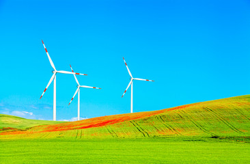 Wind electricity generators in spring fields.