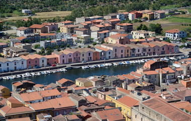 aerial view of the ancient city of Bosa with the Temo river and the facades of the old tanneries,...