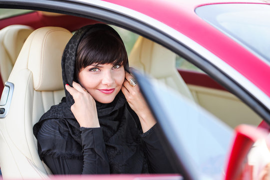 Portrait of an arabic young woman with her beautiful blue eyes in traditional middle eastern dress.