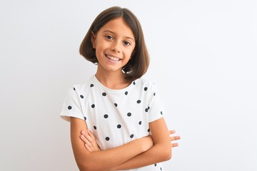 Young beautiful child girl wearing casual t-shirt standing over isolated white background happy face smiling with crossed arms looking at the camera. Positive person.