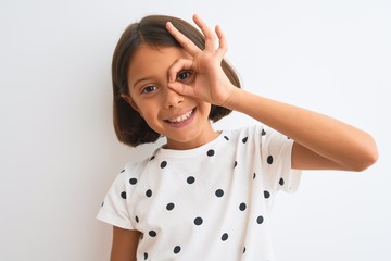 Young beautiful child girl wearing casual t-shirt standing over isolated white background with...