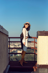 Stylish young girl in an autumn look