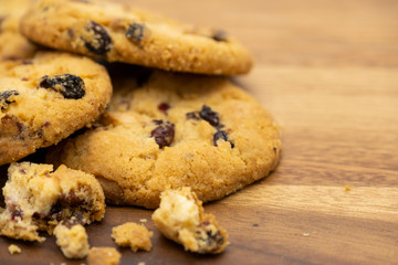 Pile of delicious tasty recipe apple cookies homemade with small pieces isolated on wooden table