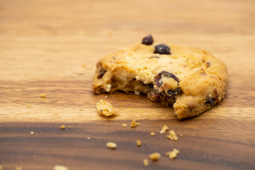 Delicious tasty recipe apple cookies homemade with bite isolated on wooden table