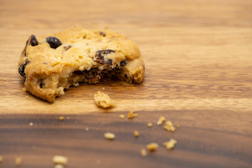 Delicious tasty recipe apple cookies homemade with bite isolated on wooden table