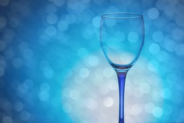 wine glass of flying water on blue background