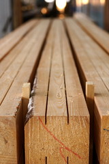 Image of wooden beams with cuts and color marks