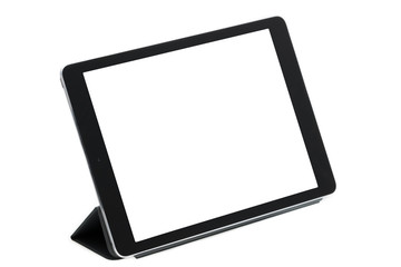 Tableta sobre fondo blanco en soporte gris derecha