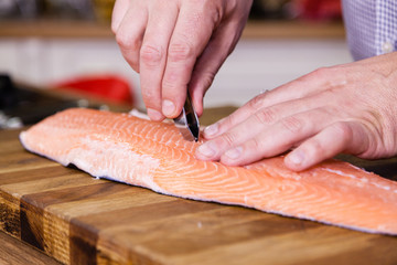 Removing fish bones.