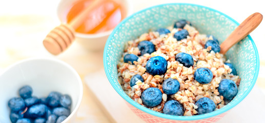 buckwheat porridge with fruits and honey, chia seeds, flax seeds, the concept of a healthy breakfast, diet, veganism, vitamins