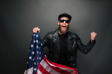 Patriot hipster man holding emotionally american USA flag