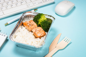 Food delivery concept - healthy lunch on office table.