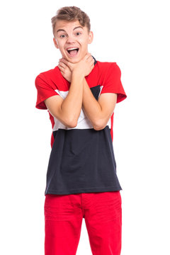 Emotional portrait of caucasian teen boy with hands on neck. Crazy child, isolated white background. Handsome funny teenager choke sheself and clenching hands on neck. Negative emotions.
