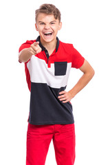 Aggressive angry Teen Boy screaming and pointing finger on camera, isolated on white background. Emotional portrait of handsome caucasian child looking at camera choosing you - accusing someone.