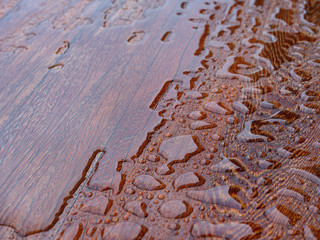 Wooden planks bathed in the rain