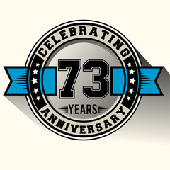 Celebrating 73 years anniversary logo vintage emblem with blue ribbon. Retro vector background.