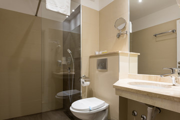 Hotel bathroom interior with shower cabin