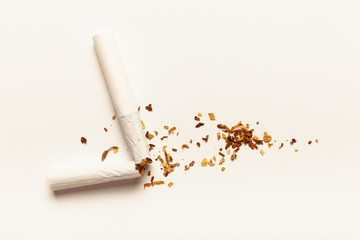 Cigarettes on white background. Addiction to smoking, harm of tobacco smoke. Bad habit, smoking kills.