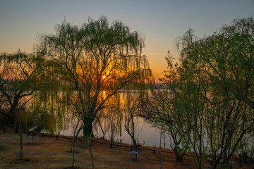 Fototapeta na wymiar Sunrise over Rietvlei dam nature reserve outside Pretoria, South Africa.